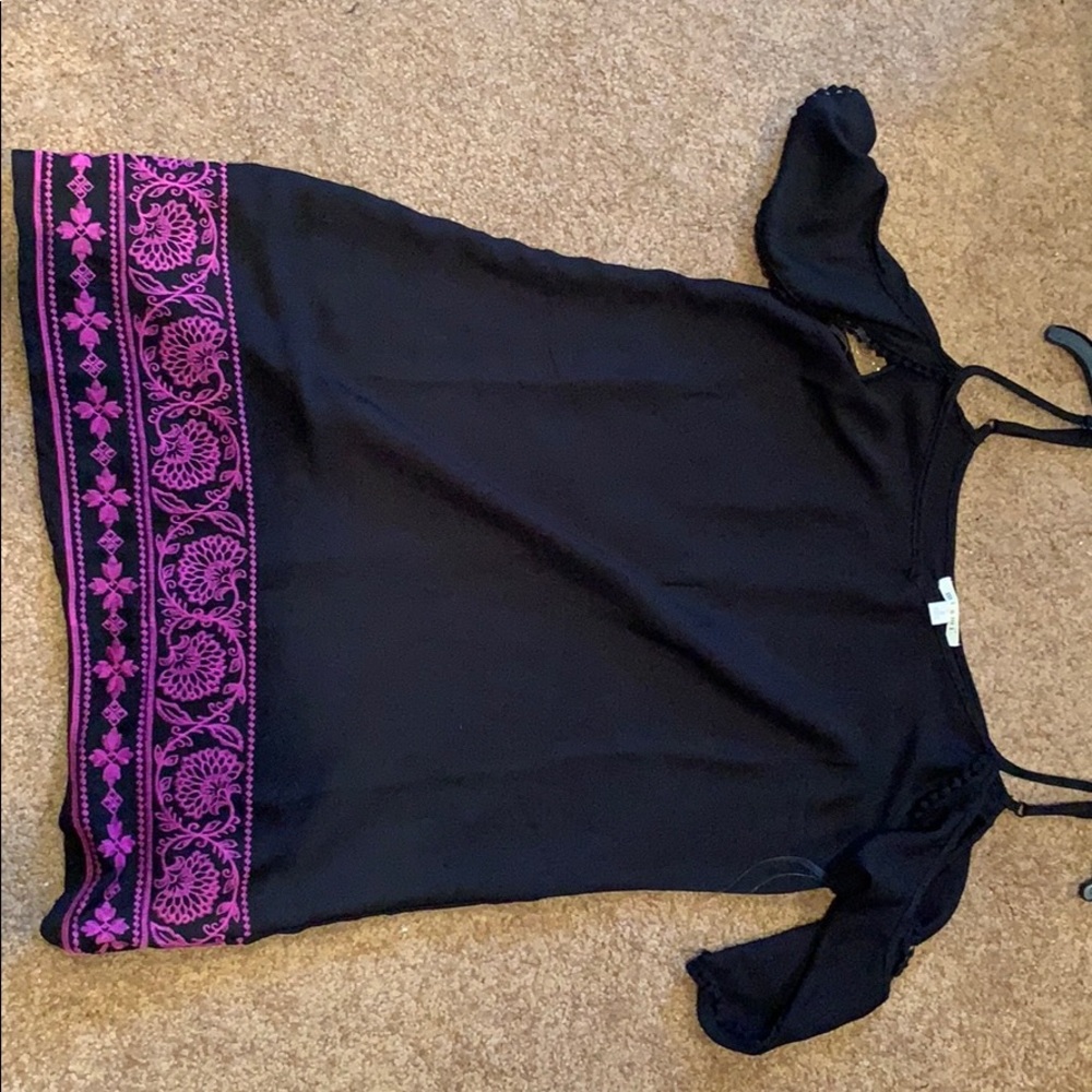 Purple and black off the shoulder dress.